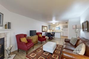 a living room with a leather couch and chairs at Private Townhome - Mountain Views & 2 Baths in Boise