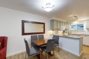 a kitchen and dining room with a table and chairs at Private Townhome - Mountain Views & 2 Baths in Boise +31 photos