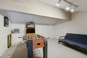 a living room with a stove and a couch at McCall Mountain Condo Pool Sauna Deck in McCall