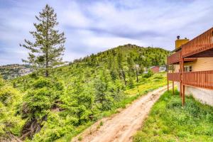 a dirt road next to a house on a hill at Mountain Retreat Slope Access 2 Decks in Boise