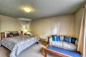 a bedroom with a bed and a couch at Mountain Retreat Slope Access 2 Decks in Boise +20 photos