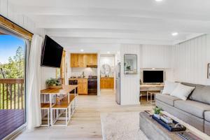 a living room with a couch and a kitchen at Ski-In Ski-Out Studio at Bogus Basin in Boise