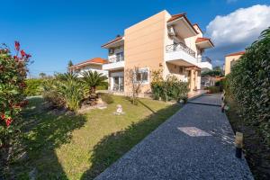 a view of a house from the driveway at Filerimos Dream Villa in Ialysos
