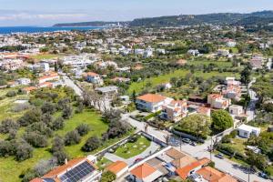 an aerial view of a city with buildings and trees at Filerimos Dream Villa in Ialysos