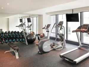 a gym with several treadmills and exercise machines at ibis Styles Jakarta Tanah Abang in Jakarta +69 photos