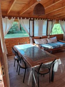 a living room with a table and a couch at El Druida 3 in Villa General Belgrano