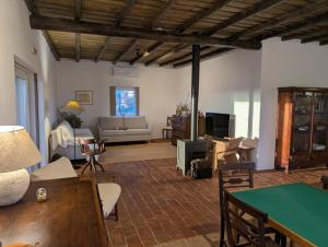 a living room with a couch and a table at Herdade dos Calvinos, Monte 2 - Alandroal in Parreiras
