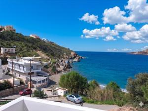 a view of the ocean from a house at Louis Studios and Apartments Melitsaha Beach in Kalymnos