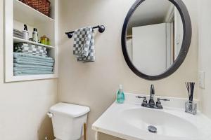 a bathroom with a sink and a mirror at The Treehouse at Banner Elk in Banner Elk +10 photos