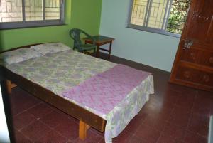 Postel nebo postele na pokoji v ubytování Hotel Anjali Lodge Malvan