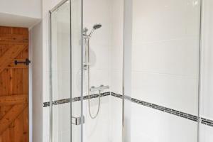 a shower with a glass door in a bathroom at 2 Bed in Somerton oc-w29203 in Somerton +14 photos