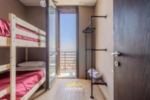 a room with two bunk beds and a door at Sest0la Centro Loft con Vista sul Paesaggio in Sestola