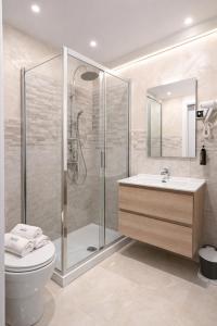 a bathroom with a shower and a toilet and a sink at Appio Rooms Haven in Rome
