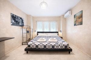 a bedroom with a bed with towels on it at Appio Rooms Haven in Rome
