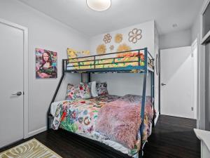 a bedroom with a bunk bed in a room at Renovated Cottage - Game Room - Fire Pit - Sleeps 8 in Moreland Hills