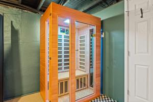 a room with a wooden door and a window at The Paper Plane Pool - Sauna - Poker Room - Sleeps 8 in Dayton