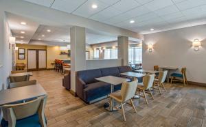 a lobby with a couch and tables and chairs at Hampton Inn Channel Islands Harbor in Oxnard