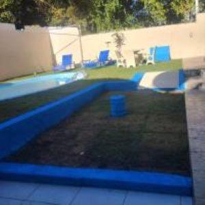 a view of a swimming pool in a yard at Pousada Bromelias in Imbassai +21 photos