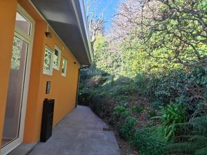 a hallway of a house with an orange wall at Casa Bice Cernobbio in Cernobbio