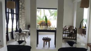 a room with a living room with a table and chairs at Coqui Coqui Papholchac Coba Residence & Spa in Coba +34 photos