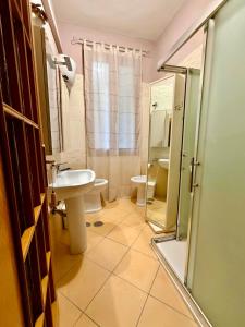 a bathroom with a toilet and a sink and a shower at Susanna's House in Nocera Inferiore +52 photos