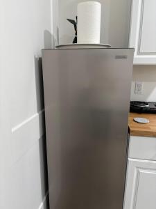 a roll of paper towels sitting on top of a refrigerator at dary hause in Indianapolis