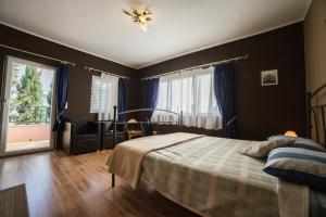 Postel nebo postele na pokoji v ubytování Villa Lugano