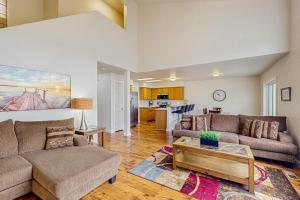a living room with a couch and a coffee table at Park View Townhouse in Boise