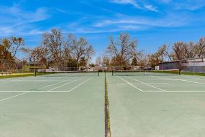 a tennis court with two tennis nets on it at Park View Townhouse in Boise