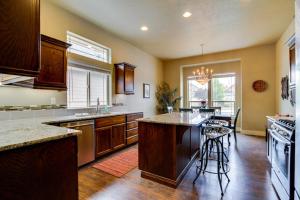 a large kitchen with a island in the middle at Sunglow Townhouse in Boise