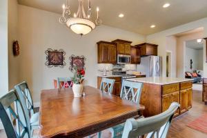 a kitchen and dining room with a wooden table and chairs at Sunglow Townhouse in Boise