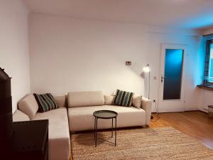 a living room with a couch and a table at Urlaub in den Bergen in Puchberg am Schneeberg