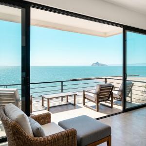 a living room with a view of the ocean at Kocoy Oceanfront condo in Punta Peninsula in Bahía Kino