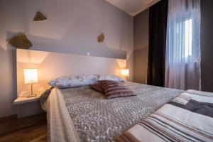 Postel nebo postele na pokoji v ubytování Villa Lugano
