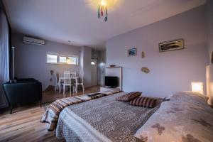 Postel nebo postele na pokoji v ubytování Villa Lugano