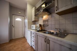Kuchyň nebo kuchyňský kout v ubytování Villa Lugano