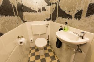a bathroom with a toilet and a sink at The Heritage - R.Q.C. in The Hague +29 photos