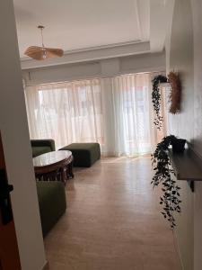 a living room with a couch and a table at Central Urban Terrace in Rabat