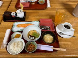a table with a tray of food on a table at Nakayasu Ryokan in Kanazawa