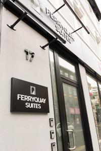 a sign on the side of a store at Derry City Centre 1 & 2 Bedroom Modern Apartments in Derry Londonderry
