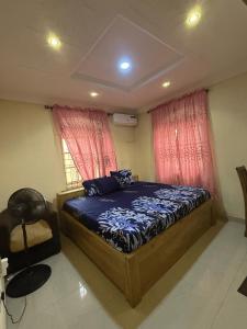 a bedroom with a bed and a window at CEO Da Gracia Hotel, Irewon, Ijebu Ode in Ijebu Ode