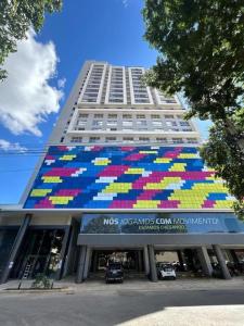 a building with a colorful mural on the side of it at City House 204 in Barreiras +3 photos