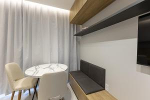 a small dining room with a table and chairs at City House 204 in Barreiras