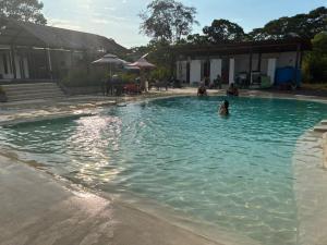 a person swimming in a swimming pool at Animal Glamping in Pomona