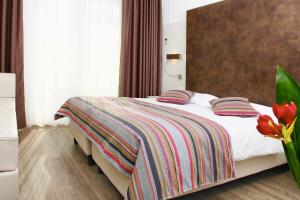 Letto o letti in una camera di Colorado Hotel