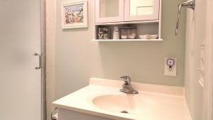 a bathroom with a sink and a shower at Summer Breeze in Cape May Point +27 photos