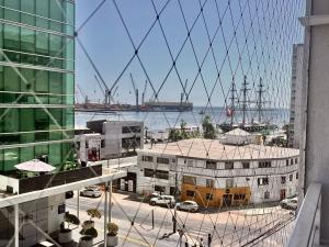 a view of a harbor from a building at Edificio Lynch- Sector Centro Depto Full Equipado 2D2B Estacionamiento in Iquique