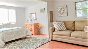 a living room with a couch and a dresser at 505 Sandalwood Road in Wildwood Highlands Beach