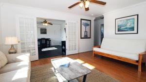 a living room with a couch and a table at 505 Sandalwood Road in Wildwood Highlands Beach