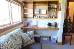 a living room with a couch and a desk at La Casa in Napier